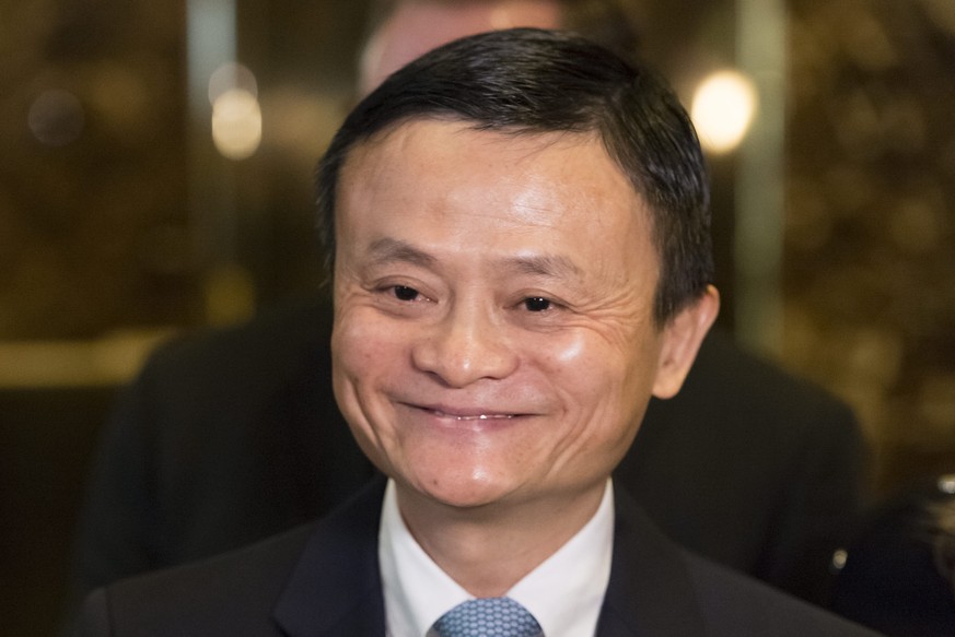 epa05707996 Jack Ma (C), Founder and Executive Chairman of Alibaba Group, speaks to press as he arrives for a meeting with President-elect Trump, in the lobby of Trump Tower in New York, New York, USA ...