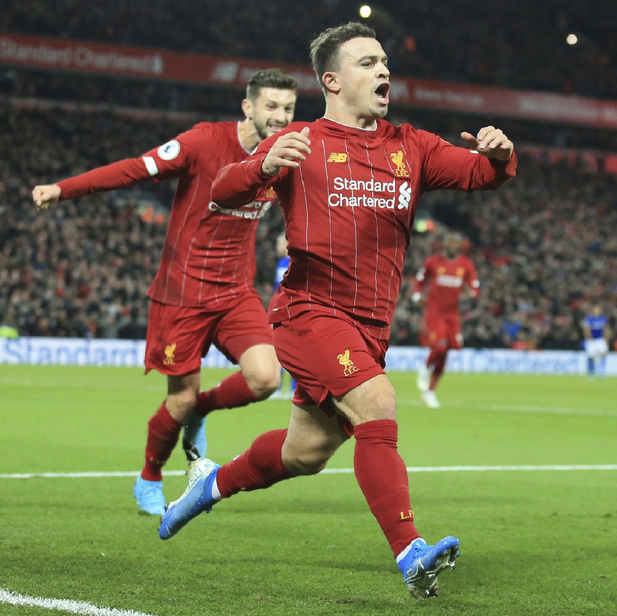 Liverpool's Xherdan Shaqiri celebrates his goal against Everton during the English Premier League soccer match between Liverpool and Everton at Anfield Stadium, Liverpool, England, Wednesday, Dec ...