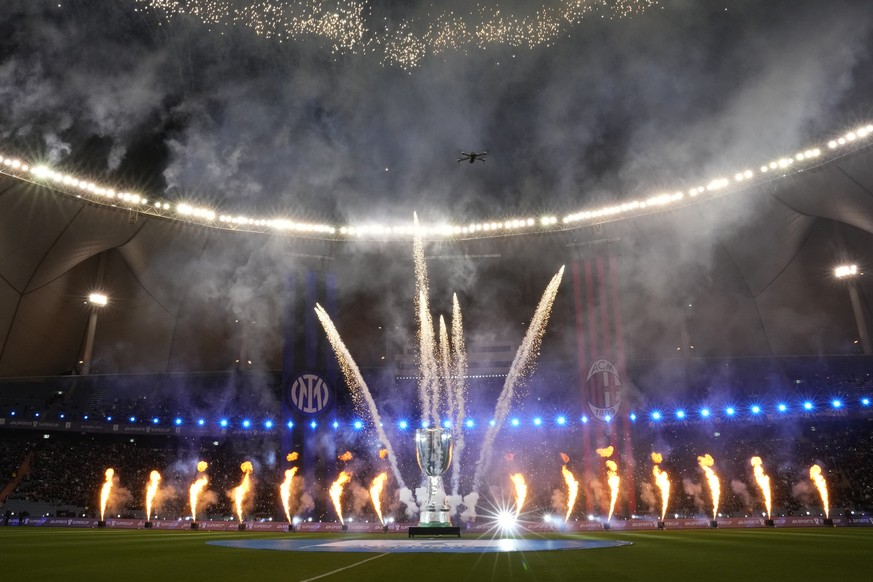 Fireworks explode before the Italian Super Cup final soccer match between AC Milan and Inter Milan at the King Saud University Stadium, in Riyadh, Saudi Arabia, Wednesday, Jan. 18, 2023. (AP Photo/Hus ...