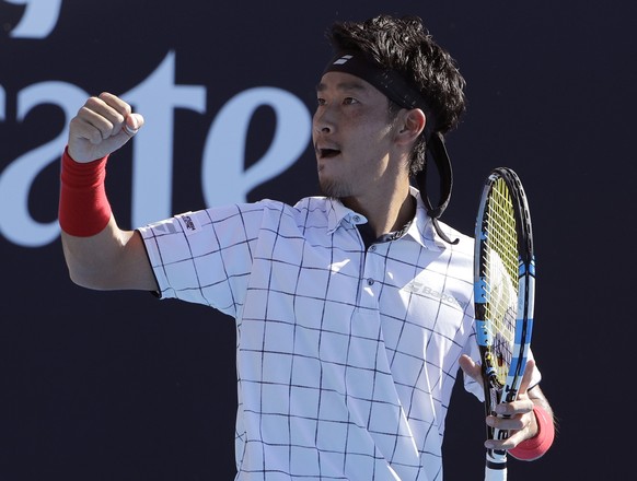 Japan&#039;s Yuicha Sugita celebrates a point win over United States&#039; Jack Sock during their first round match at the Australian Open tennis championships in Melbourne, Australia, Monday, Jan. 15 ...