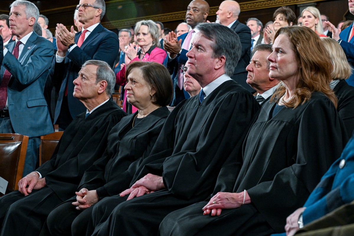 From left, Chief Justice John Roberts, Justice Elena Kagan, Justice Brett Kavanaugh and Justice Amy Coney Barrett stand before President Donald Trump delivers the State of the Union address to a joint ...