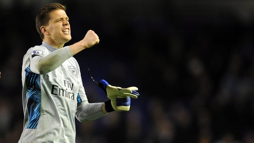 epa03154161 Wojciech Szczesny goalkeeper for Arsenal celebrates at the end of the English Premier League soccer match at Goodison Park in Liverpool, Britain, 21 March 2012. EPA/PETER POWELL DataCo ter ...