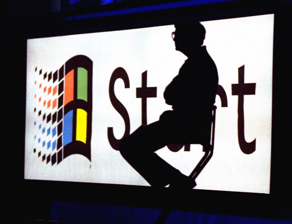 FILE - In this Aug. 24, 1995, file photo, Microsoft Chairman Bill Gates sits on stage during a video portion of the Windows 95 Launch Event on the company's campus in Redmond, Wash. One of the bi ...