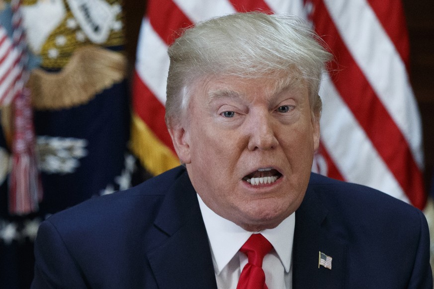 President Donald Trump speaks during a meeting with business leaders in the State Department Library on the White House complex in Washington, Tuesday, April 11, 2017. Carlos G. Muniz, a former top ai ...