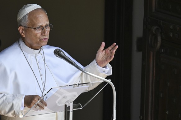 epa13133786 Pope Leo XIV delivers the Angelus prayer from the entrance of the Apostolic Palace overlooking Piazza della Liberta' at the Papal summer residence in Castel Gandolfo, near Rome, Italy ...