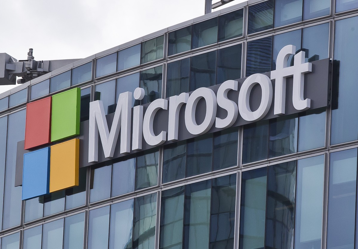 FILE - This April 12, 2016 file photo shows the Microsoft logo in Issy-les-Moulineaux, outside Paris, France. Ongoing demand for Microsoft's cloud computing services help softened the blow of the ...