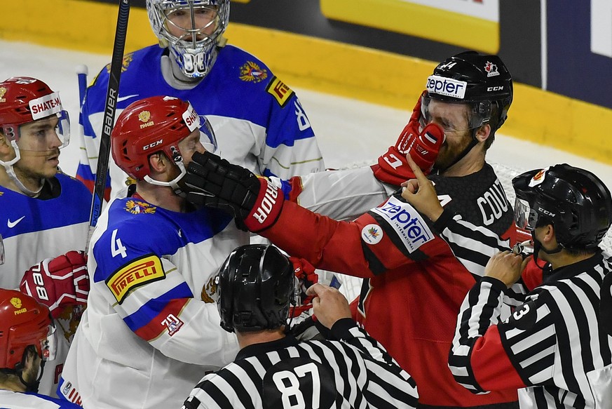 Canada&#039;s Sean Couturier, right, fights with Russia&#039;s Vladislav Gavrikov during the Ice Hockey World Championships semifinal match between Canada and Russia in the LANXESS arena in Cologne, G ...