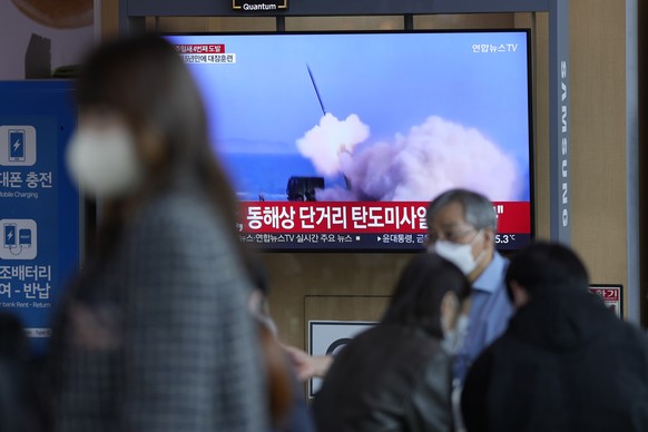 A TV screen showing a news program reporting about North Korea's missile launch with file footage, is seen at the Seoul Railway Station in Seoul, South Korea, Saturday, Oct. 1, 2022. On Saturday, Nort ...