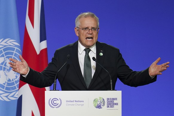 Scott Morrison, Prime Minister of Australia delivers an address, during the COP26 Summit, at the SECC in Glasgow, Scotland, Monday, Nov. 1, 2021. (Ian Forsyth/Pool Photo via AP)