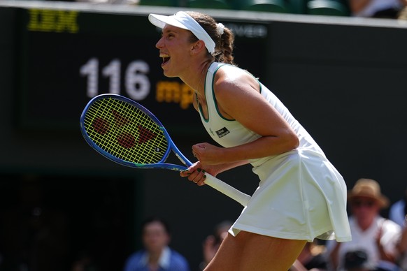 Elise Mertens of Belgium celebrates her victory against Elena Rybakina of Kazakhstan in their third round women's singles match at the Wimbledon Tennis Championships in London, Saturday, July 4,  ...