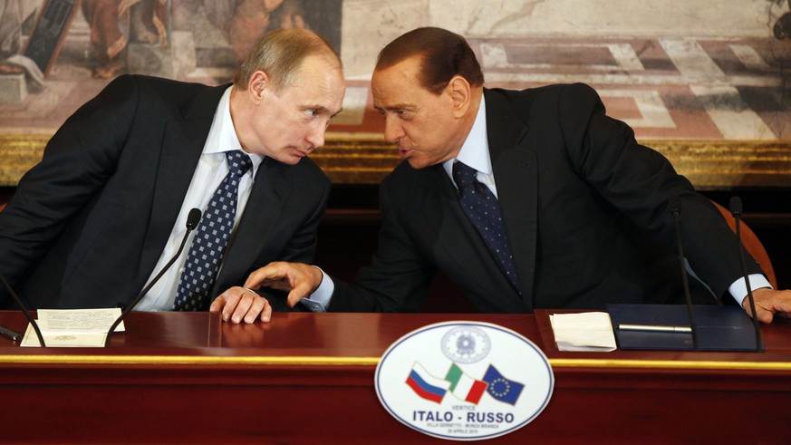 FILE -- In this April 26, 2010 file photo, then Italian Premier Silvio Berlusconi, right, and Russian President Vladimir Putin talk during a press conference at Villa Gernetto, in Gerno, near Milan, I ...