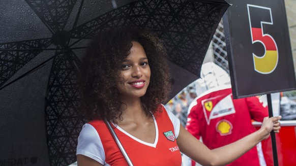 epa05336345 A grid girls holds number five of German Formula One driver Sebastian Vettel of Scuderia Ferrari on the grid prior to the 2016 Formula One Grand Prix of Monaco at the Monte Carlo circuit i ...
