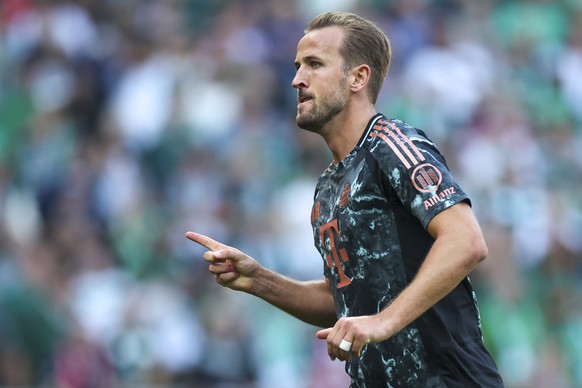 epa11617535 Harry Kane of Munich celebrates after scoring 0-3 goal during the German Bundesliga soccer match between SV Werder Bremen and FC Bayern Munich in Bremen, Germany, 21 September 2024. EPA/CH ...