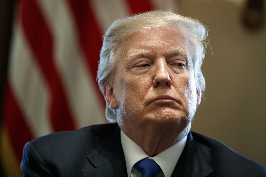 FILE- In this Jan. 9, 2018, file photo, President Donald Trump listens during a meeting with lawmakers on immigration policy in the Cabinet Room of the White House in Washington. Trump used profane la ...