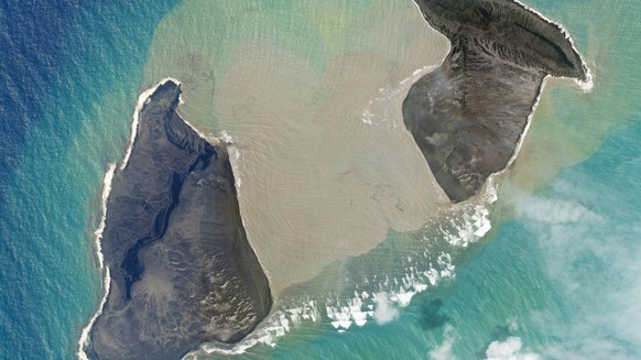 In this satellite photo taken by Planet Labs PBC, an island created by the underwater Hunga Tonga Hunga Ha&#039;apai volcano is just before a massive eruption Saturday, Jan. 15, 2022. An undersea volc ...