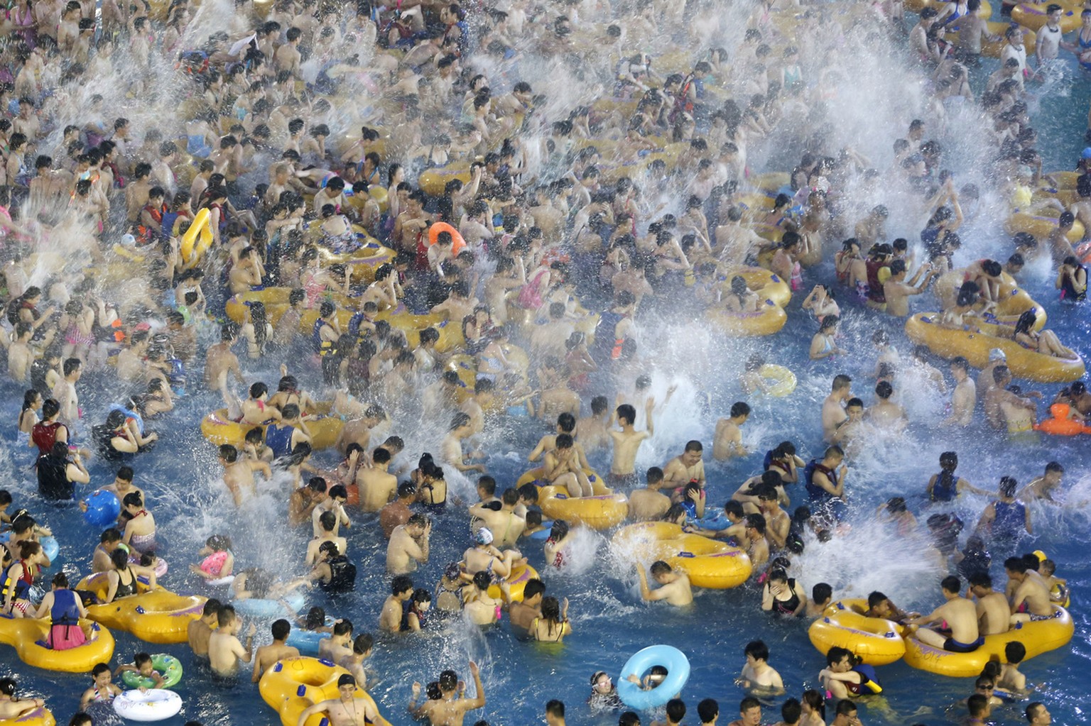 Visitors at a water park enjoy themselves in Wuhan in central China's Hubei province Saturday, July 13, 2013. (AP Photo) CHINA OUT