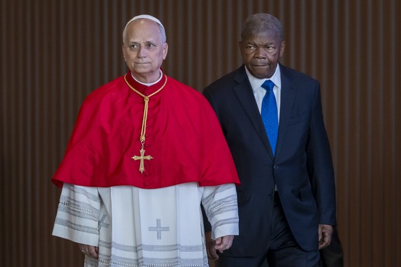epa12898705 Pope Leo XIV (L) and Angolan President Joao Lourenco arrive for a meeting with the authorities, civil society and the diplomatic corps at the Presidential Palace in Luanda, Angola, 18 Apri ...