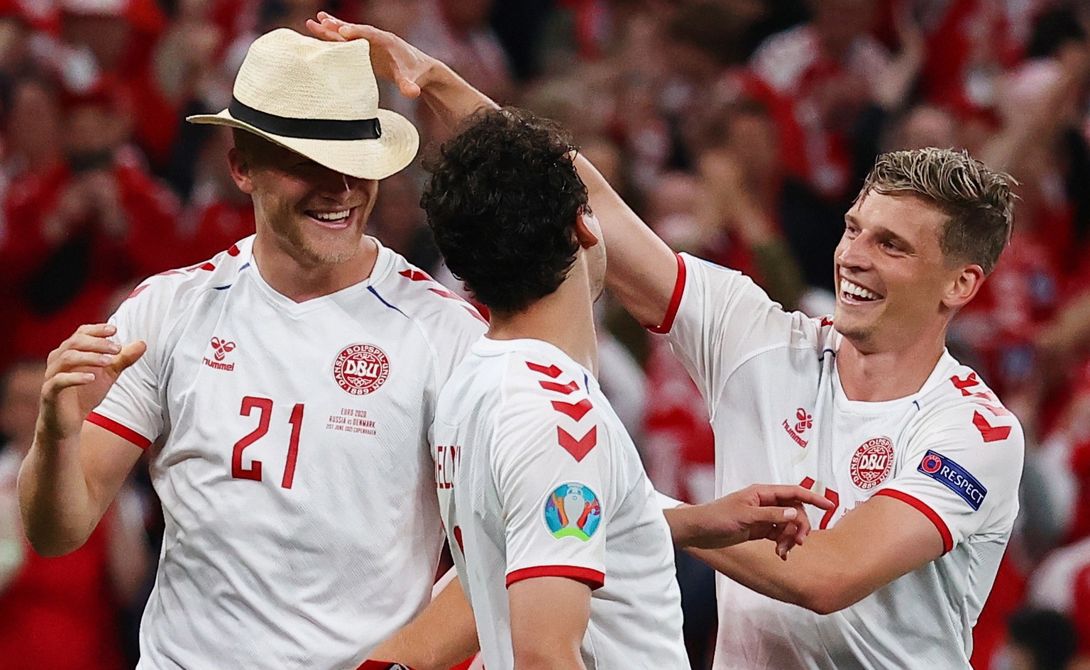 epa09292208 Players of Denmark celebrate after winning the UEFA EURO 2020 group B preliminary round soccer match between Russia and Denmark in Copenhagen, Denmark, 21 June 2021. EPA/Wolfgang Rattay / ...