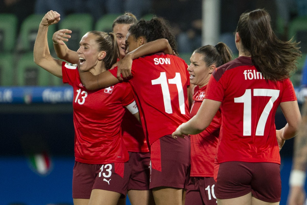 Switzerland's midfielder Coumba Sow #11 celebrates her goal with her teammates after scoring the 0:1, during the FIFA Women's World Cup 2023 qualifying round group G soccer match between the ...