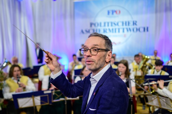 epa11153515 Herbert Kickl, leader of the right-wing Austrian Freedom Party (FPOe), conducts an orchestra during the party&#039;s traditional political Ash Wednesday meeting in Ried im Innkreis, Austri ...