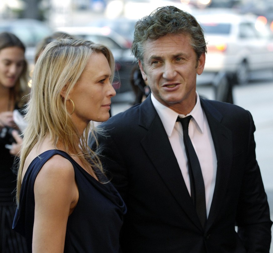 Sean Penn, director of the film &quot;Into the Wild,&quot; arrives with his wife Robin Wright Penn at the Los Angeles premiere of the film, Tuesday, Sept. 18, 2007. (AP Photo/Chris Pizzello)