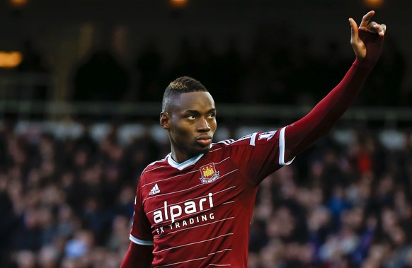 FILE - In this Sunday, Dec. 7, 2014 file photo, West Ham&#039;s Diafra Sakho celebrates scoring a goal during the English Premier League soccer match between West Ham and Swansea at White Hart Lane st ...