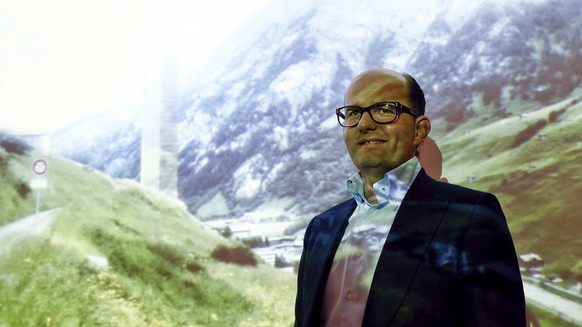 Remo Stoffel, managing director of Swiss Priora Holding AG poses in front of a picture of the planned '7132 hotel' after a news conference in the town of Kloten near Zurich March 25, 2015. Stoffel pre ...
