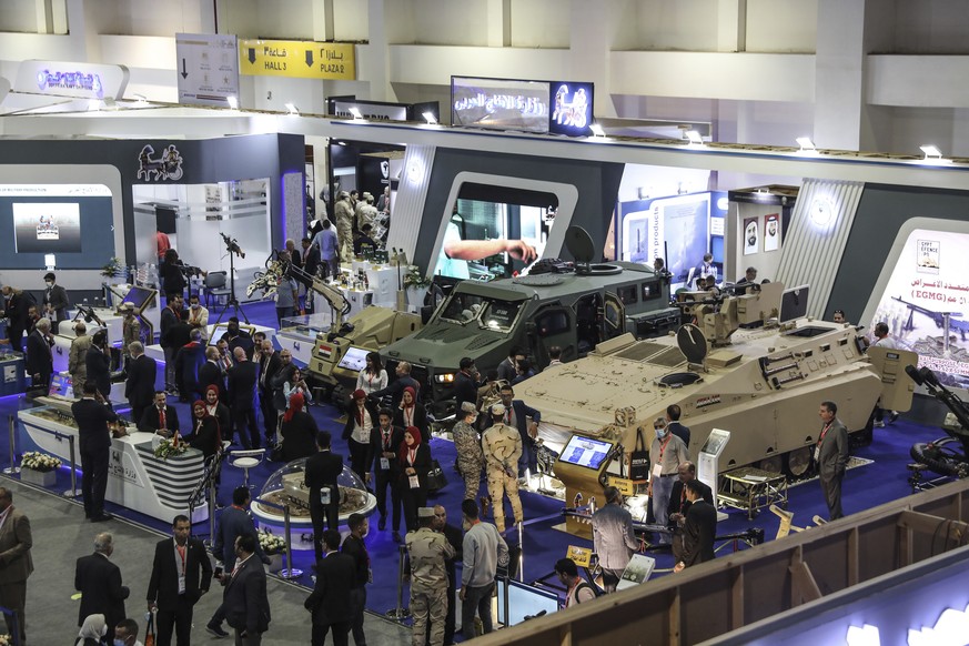People visit the Egypt Defence Exhibition 2021 (EDEX), in new Cairo, Egypt, Tuesday, Nov. 30, 2021. (AP Photo/Mohamed El-Shahed)