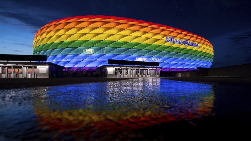 The Allianz Arena lights up in rainbow colors on the occasion of Christopher Street Day, in Munich, Germany, Saturday, July 10, 2021. Due to the coronavirus pandemic, the big parade was cancelled agai ...