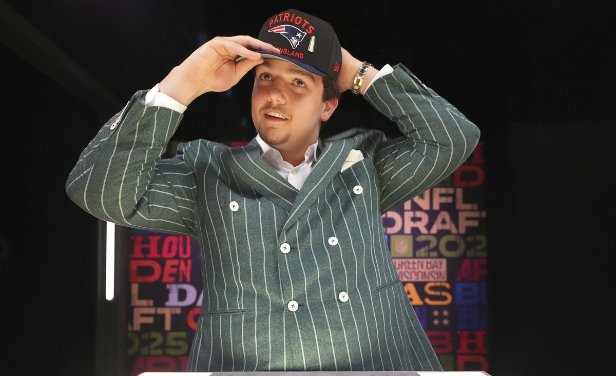 LSU offensive tackle Will Campbell puts on a hat after being chosen by the New England Patriots with the fourth overall pick during the first round of the NFL football draft, Thursday, April 24, 2025, ...
