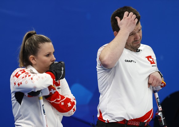 epa09723034 Jenny Perret (L) and Martin Rios of Switzerland react during the Curling Mixed Doubles Round Robin match between China and Switzerland at the Beijing 2022 Olympic Games, Beijing, China, 02 ...