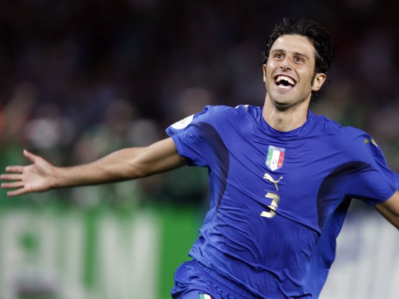 Italy &#039;s Fabio Grosso reacts after scoring the winning goal in a penalty shootout against France in the final of the soccer World Cup between Italy and France in the Olympic Stadium in Berlin, Su ...