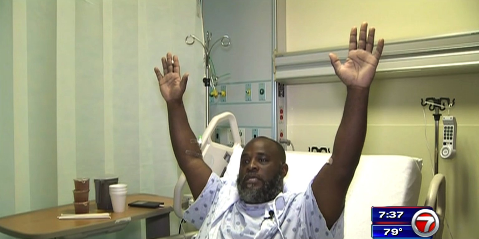 In this Wednesday, July 20, 2016, frame from video, Charles Kinsey explains in an interview from his hospital bed in Miami what happened when he was shot by police on Monday. Kinsey, a therapist who w ...