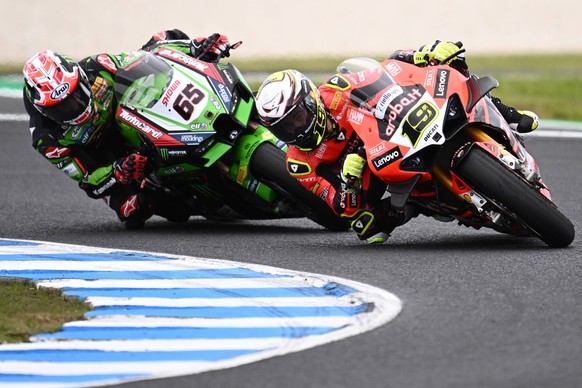 SUPERBIKES PHILLIP ISLAND, British rider Jonathan Rea of Kawasaki Racing Team left and Spanish rider Alvaro Bautista of Aruba.it Racing Ducati team during WorldSBK Race Two of the Superbike World Cham ...
