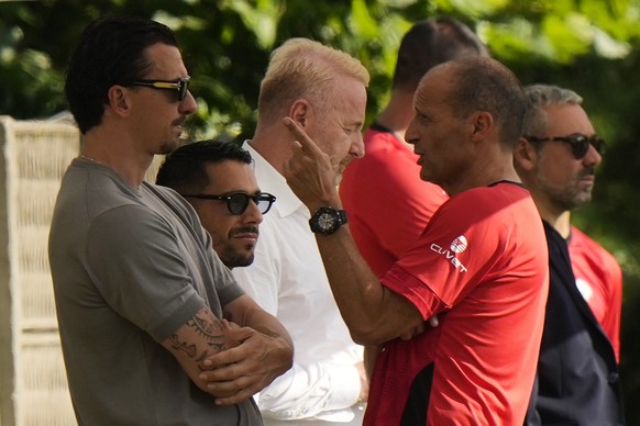New AC Milan coach Massimiliano Allegri gestures with Zlatan Ibraimovic, left, during a training session AC Milan&#039;s headquarter, in Carnago, Italy, Monday, July 7, 2025. (AP Photo/Luca Bruno)
Ita ...