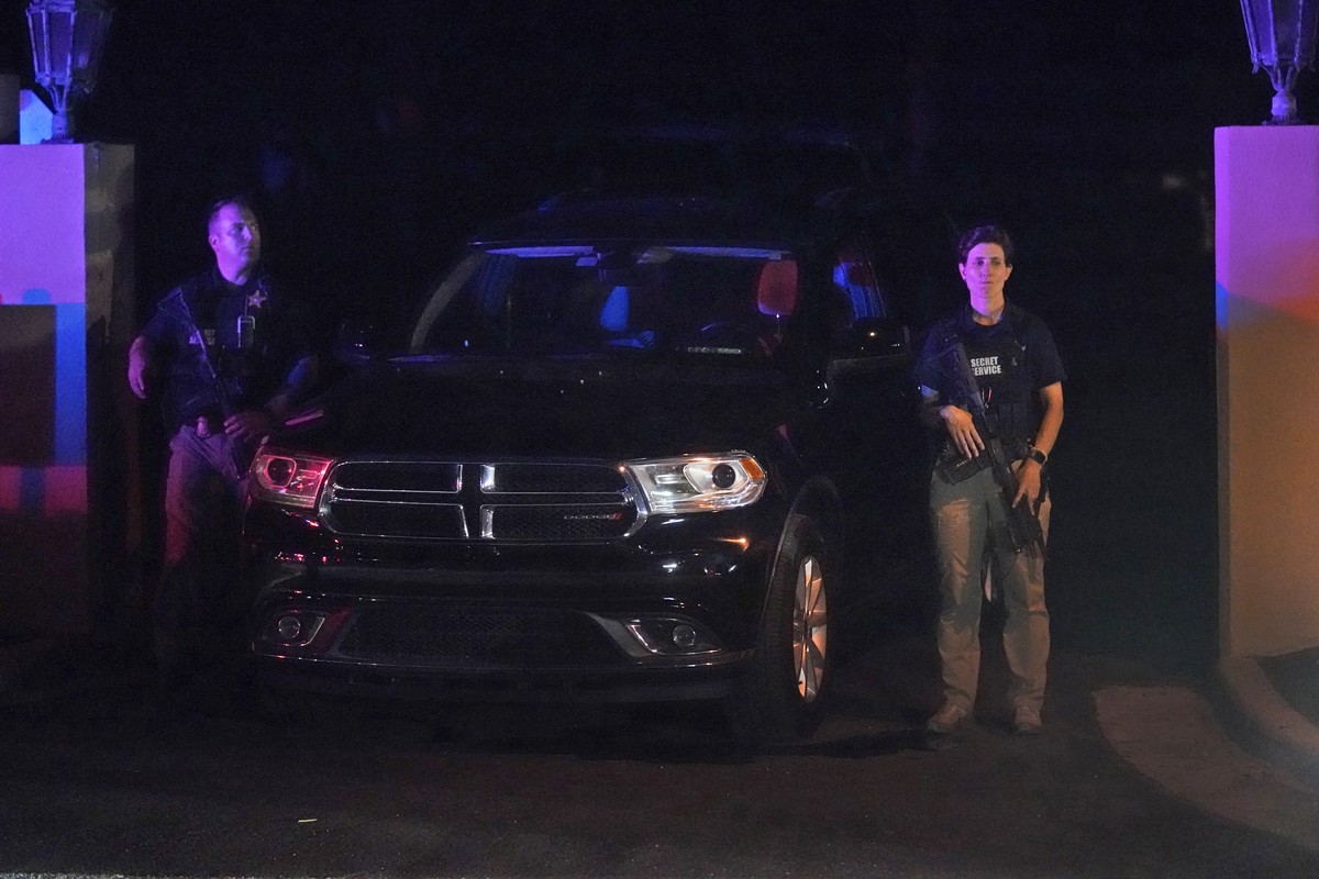 Armed Secret Service agents stand outside an entrance to former President Donald Trump's Mar-a-Lago estate, Monday, Aug. 8, 2022, in Palm Beach, Fla. Trump said in a lengthy statement that the FB ...