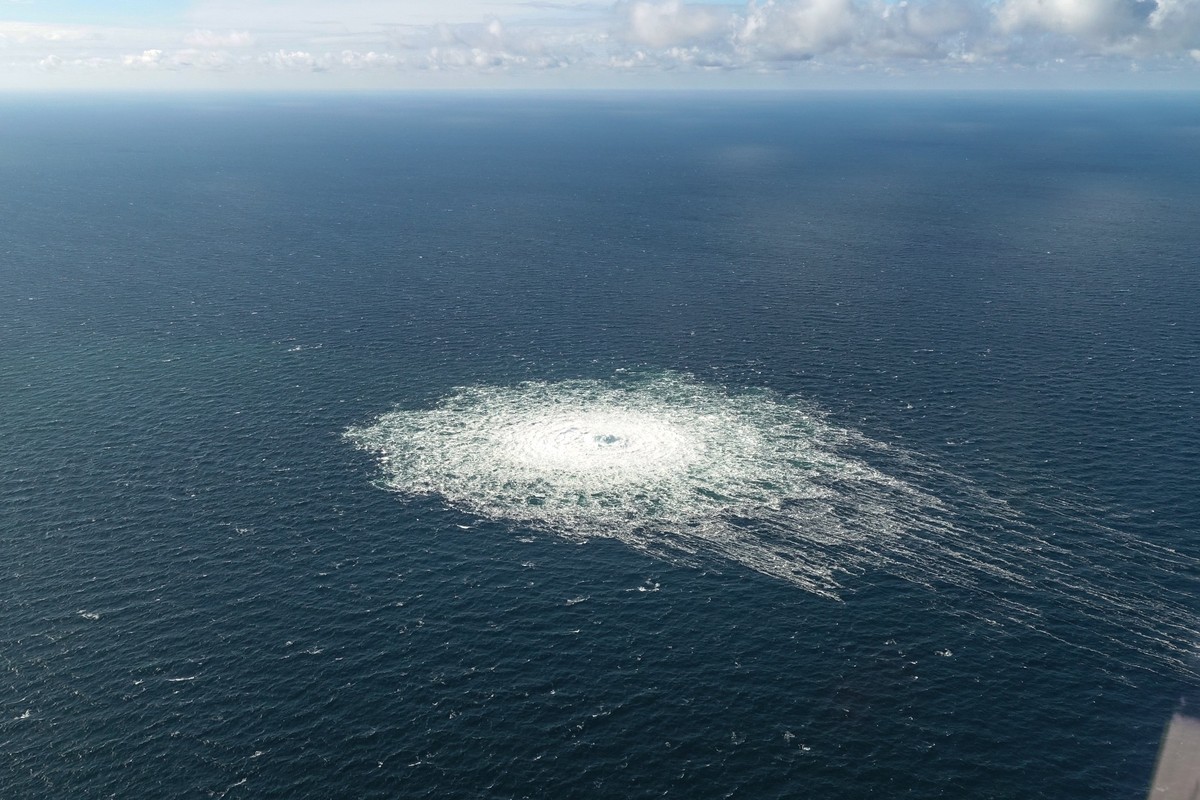 epa10209592 A handout photo taken from a Danish F-16 jet on 27 September 2022 and made available by the Danish Defence Command shows a gas leak of the Nord Stream 2 pipeline off Bornholm, Denmark, Bal ...