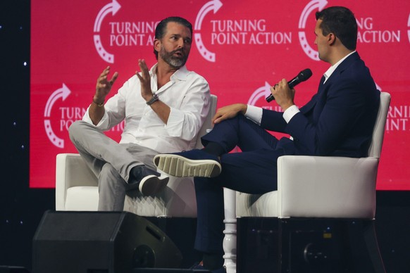 Donald Trump Jr., left, and Charlie Kirk speak on stage during day one of the Turning Point USA Student Action Summit on Friday, July 11, 2025, in Tampa. (Luis Santana/Tampa Bay Times via AP)
Turning  ...