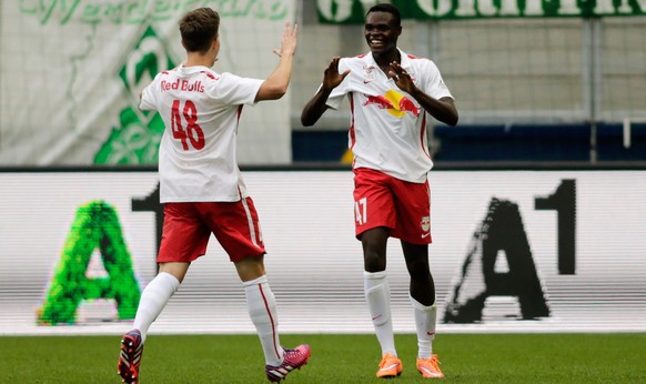 SALZBURG, AUSTRIA - JULY 11: Dimitri Oberlin (R) of Salzburg celebrates with team mate Michael Brandner after scoring his team&#039;s first goal during the pre-season match for the 3rd place between F ...