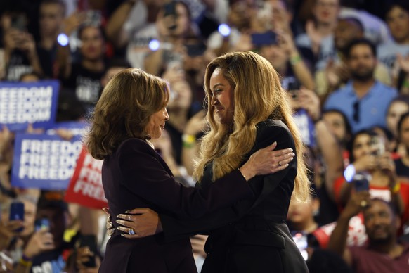 Musical artist Beyonce, right, and Democratic presidential nominee Vice President Kamala Harris, left, embrace on stage during a campaign rally Friday, Oct. 25, 2024, in Houston. (AP Photo/Annie Mulli ...