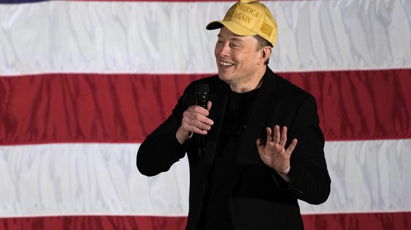 Elon Musk speaks as part of a campaign town hall in support of Republican presidential nominee former President Donald Trump in Folsom, Pa., Thursday, Oct. 17, 2024. (AP Photo/Matt Rourke)