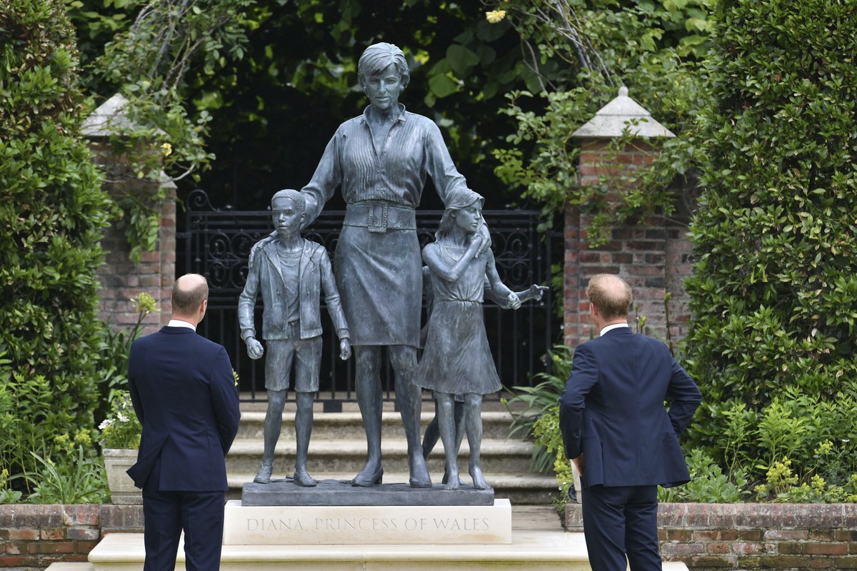 FILE - Britain's Prince William, left and Prince Harry unveil a statue they commissioned of their mother Princess Diana, on what woud have been her 60th birthday, in the Sunken Garden at Kensingt ...