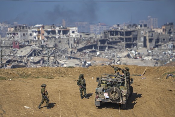 Israeli army troops are seen near the Gaza Strip border, in southern Israel, Sunday, Dec. 24, 2023. The army is battling Palestinian militants across Gaza in the war ignited by Hamas&#039; Oct. 7 atta ...