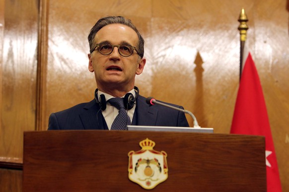 epa08922843 German Minister of Foreign Affairs Heiko Maas speaks during a joint press conference with Swedish and Jordanian counterparts in Amman, Jordan, 06 January 2021. Amman is virtually hosing th ...