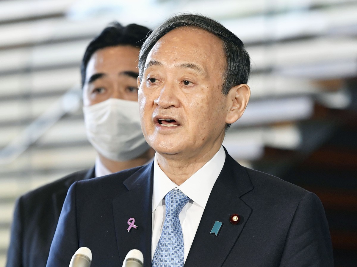 Japanese Prime Minister Yoshihide Suga speaks to the media after he held the telephone talk with U.S. President-elect Joe Biden, at the prime minister's official residence in Tokyo Thursday, Nov. ...