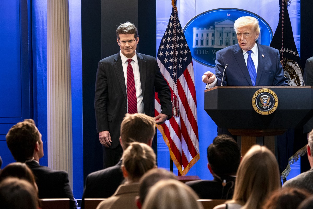 epa12763355 US President Donald J. Trump, alongside Solicitor General John Sauer (L), addresses a press conference about the Supreme Court's striking down of most of his tariffs in the briefing r ...