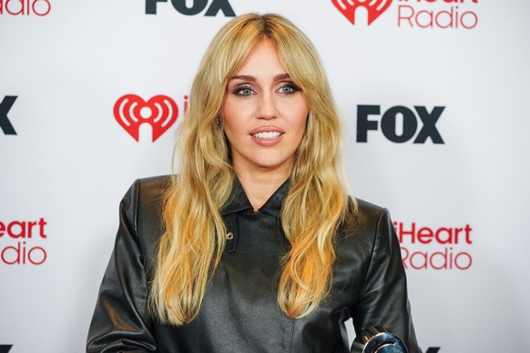 Miley Cyrus poses in the press room during the IHeartRadio Music Awards on Thursday, March 26, 2026, at the Dolby Theatre in Los Angeles. (Photo by Jordan Strauss/Invision/AP)
Miley Cyrus