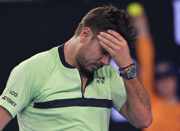 Switzerland&#039;s Stan Wawrinka reacts while playing United States&#039; Tennys Sandgren during their second round match at the Australian Open tennis championships in Melbourne, Australia, Thursday, ...
