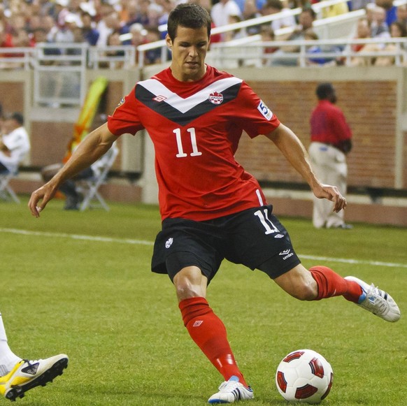 June 7, 2011 - Detroit, Michigan, U.S - Canada midfielder Josh Simpson ( 11) dribbles the ball against United States midfielder Landon Donovan ( 10) during first-half match action. The United States d ...