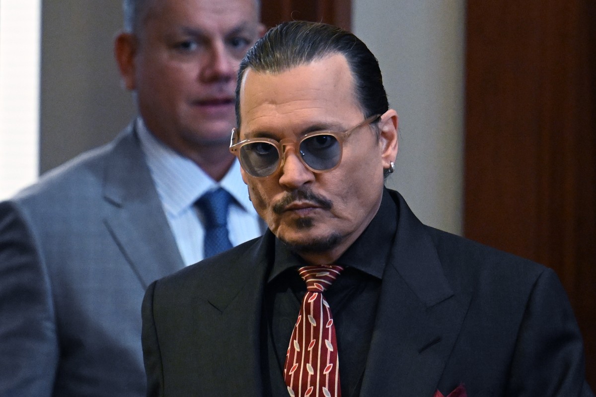 Actor Johnny Depp arrives in the courtroom at the Fairfax County Circuit Court in Fairfax, Va., Tuesday May 3, 2022. Depp sued his ex-wife Amber Heard for libel in Fairfax County Circuit Court after s ...